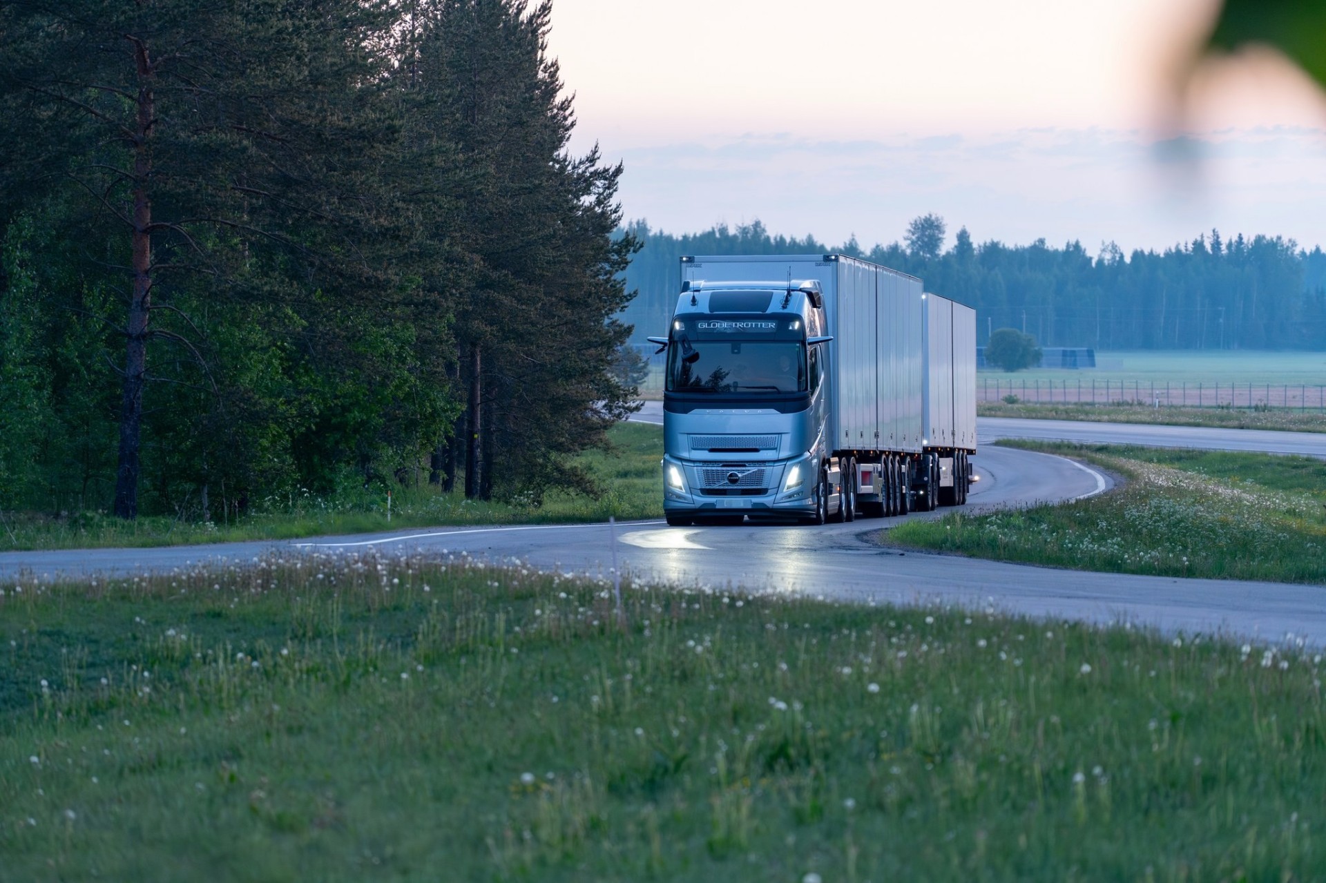 Colnord Volvo FH truck with branded curtainside trailer on a Nordic road
